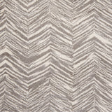 Wool broadloom carpet swatch in a painterly herringbone print in sable on a cream field.