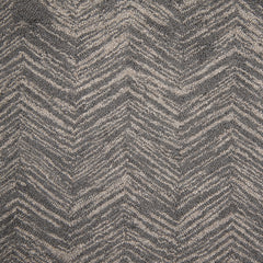 Wool broadloom carpet swatch in a painterly herringbone print in gray on a sable field.