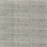 Nylon broadloom carpet swatch in a textured weave in gray.