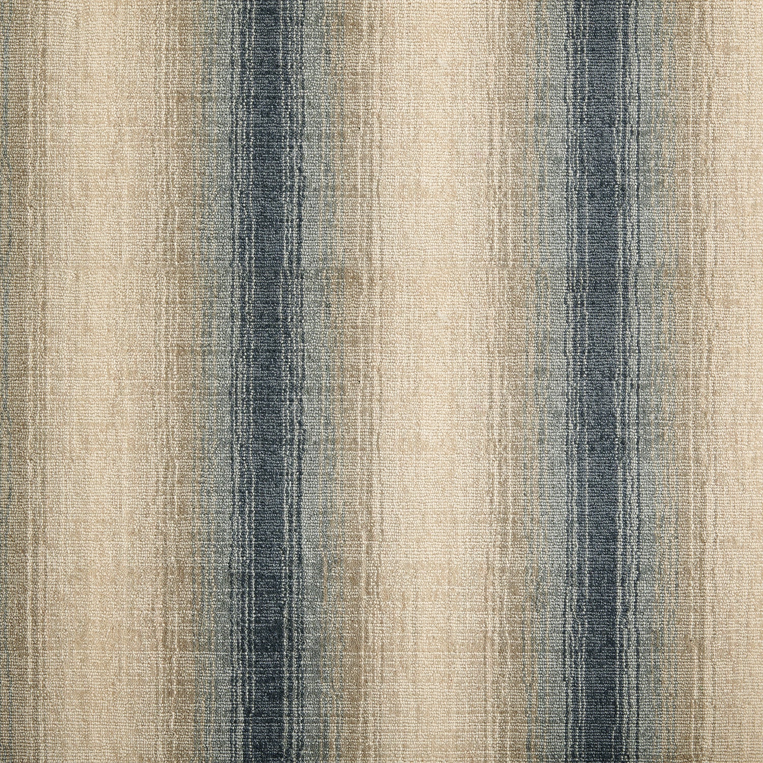 Wool-blend broadloom carpet swatch in an ombré stripe print in shades of cream, tan and gray-blue.