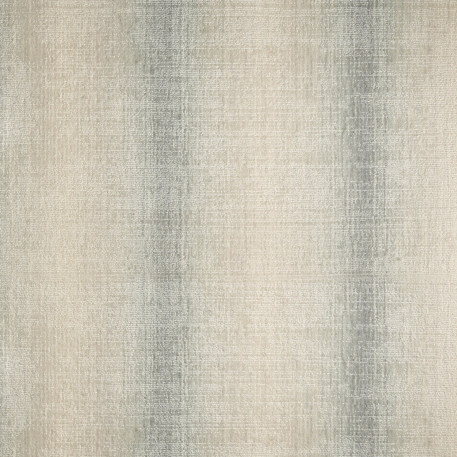 Wool-blend broadloom carpet swatch in an ombré stripe print in shades of cream and gray.