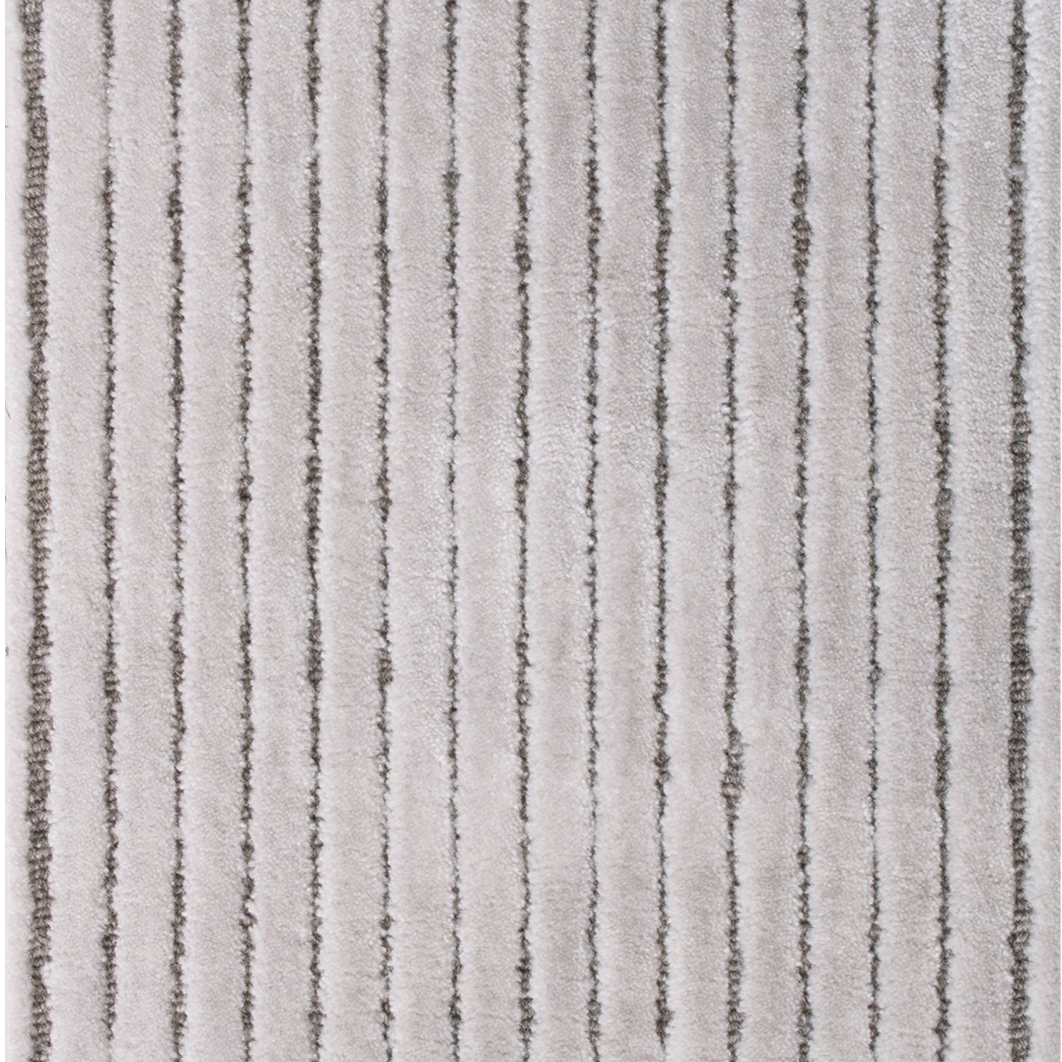 Wool-blend broadloom carpet swatch in a dimensional ribbed weave in greige and gray.