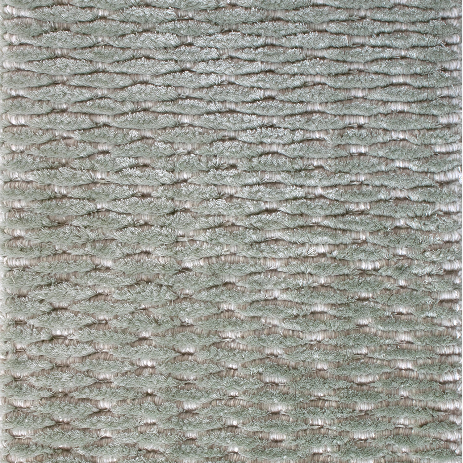 Wool-blend broadloom carpet swatch in a textured lattice print in sable on a sage field.