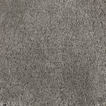 Synthetic broadloom carpet swatch in a cut pile texture in gray.