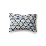 A rectangular throw pillow with a repeating Moroccan-inspired scallop pattern in white and navy on a light blue background.