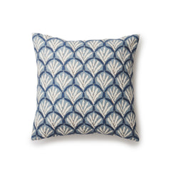 A square throw pillow with a repeating Moroccan-inspired scallop pattern in white and navy on a light blue background.