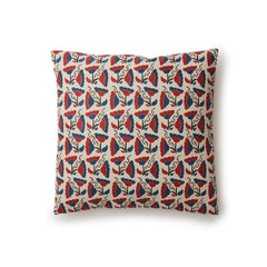 A square throw pillow with a repeating pattern of large-scale graphic flowers in red and navy on a tan background.