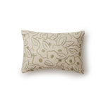 A rectangular throw pillow in a large-scale minimal floral print in shades of tan and green on a cream background.