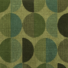 Wool-silk broadloom carpet swatch in a repeating circular pattern in shades of green on an olive field.
