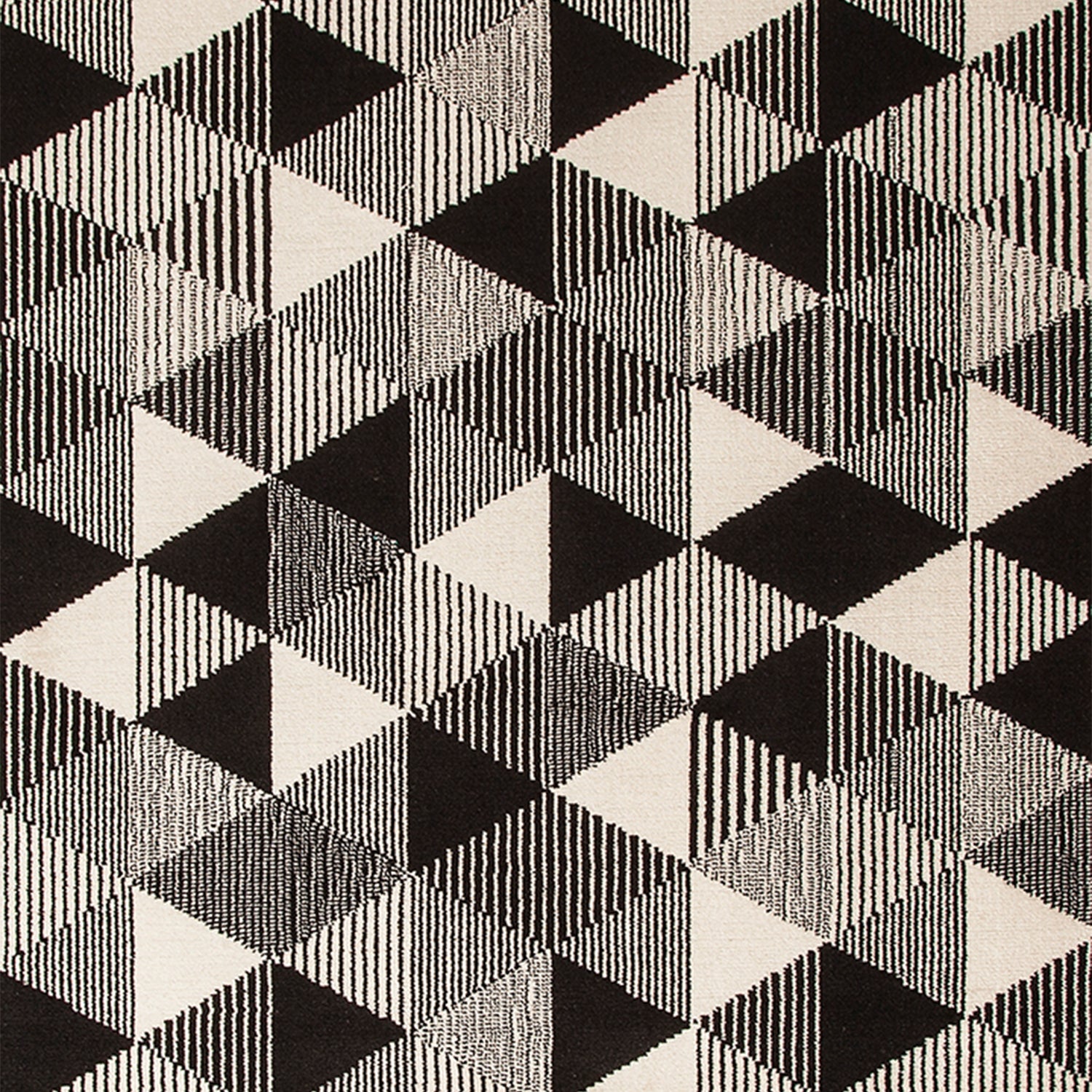 Wool-silk broadloom carpet swatch in a repeating triangle print in black and cream.