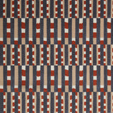 Fabric with pattern of vertical stripes of light brown, navy blue and dashes of rust red and white.