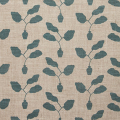 Fabric swatch with a three leafed plant in a pot motif in slate blue on a textured woven linen in oatmeal.