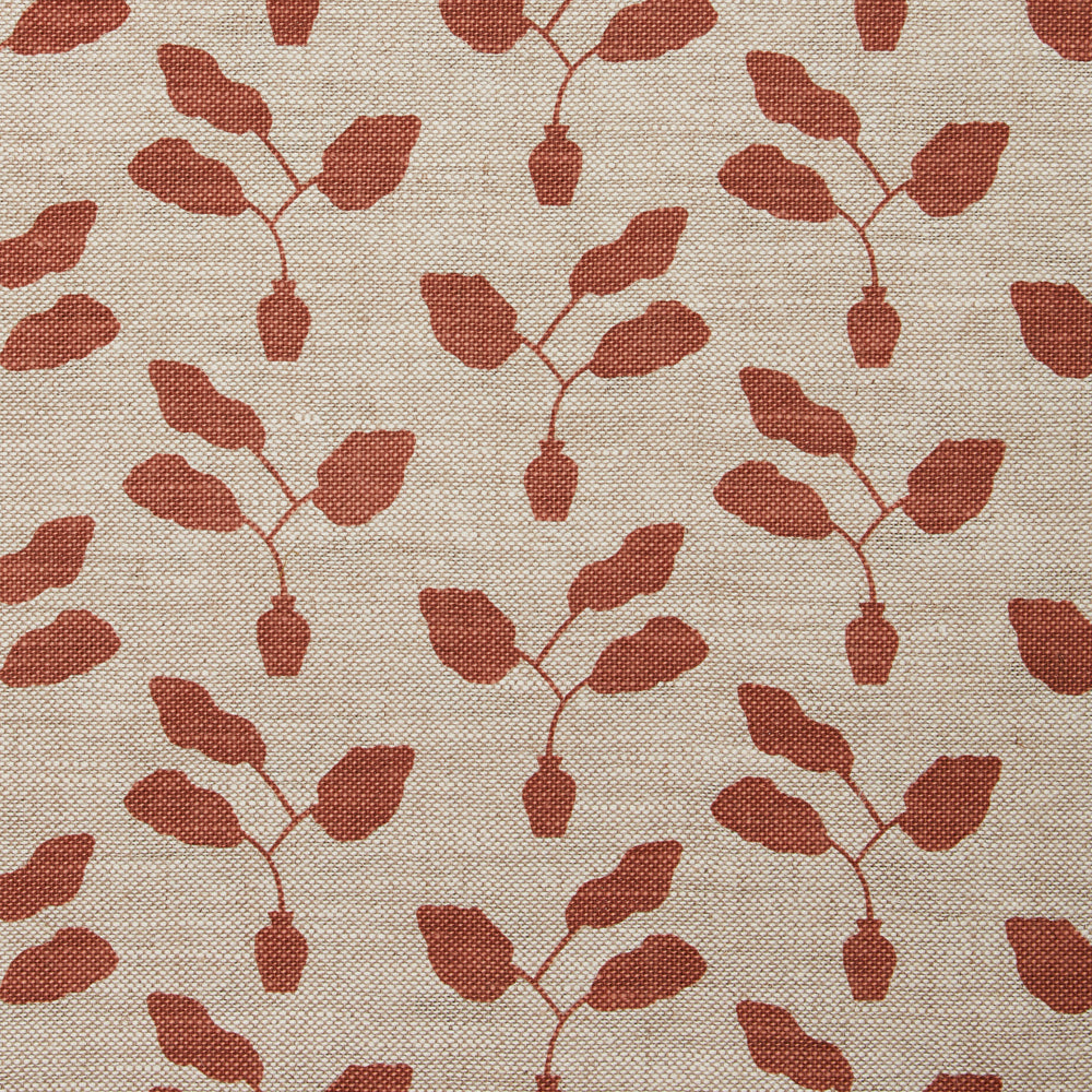 Fabric swatch with a three leafed plant in a pot motif in warm coral on a textured woven linen in oatmeal.
