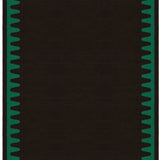 Waver Rug in Modernist Green, a solid black field with a green flame stitch border. 