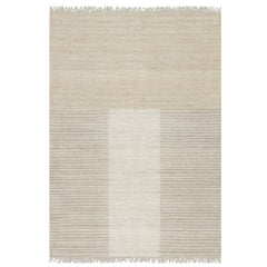 Handknotted Ridge rug rendering in tan natural colors with fringe detail.