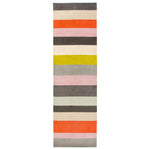 Long runner rug in color-blocked stripes of brown, beige, red and pink.