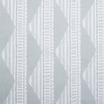 Sheer linen fabric swatch in a horizontal stripe pattern broken with triangluar shapes, in shades of gray.