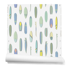 A roll of wallpaper with a pattern of illustrated surfboards in a variety of pastel colors on a cream background.