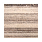 Woven rug detail in a stripe pattern in shades of cream, tan and light brown.