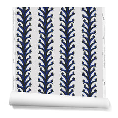 A hanging roll of wallpaper with repeating horizontal stripes of black and blue branches and fruit. Background is white.