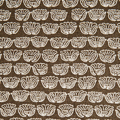 Indian-inspired floral line drawings arranged in a striped pattern on woven fabric. White on brown background.