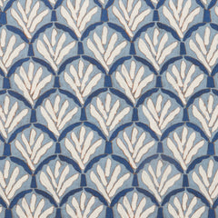 Woven fabric swatch with a repeating Moroccan-inspired scallop pattern in white and navy on a blue background.
