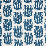 Woven fabric swatch with a repeating cartoon seaweed print in blue on a white background.