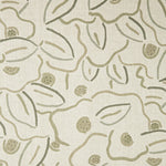 A swatch of fabric in a large-scale minimal floral print in shades of taupe and brown on a light tan background.