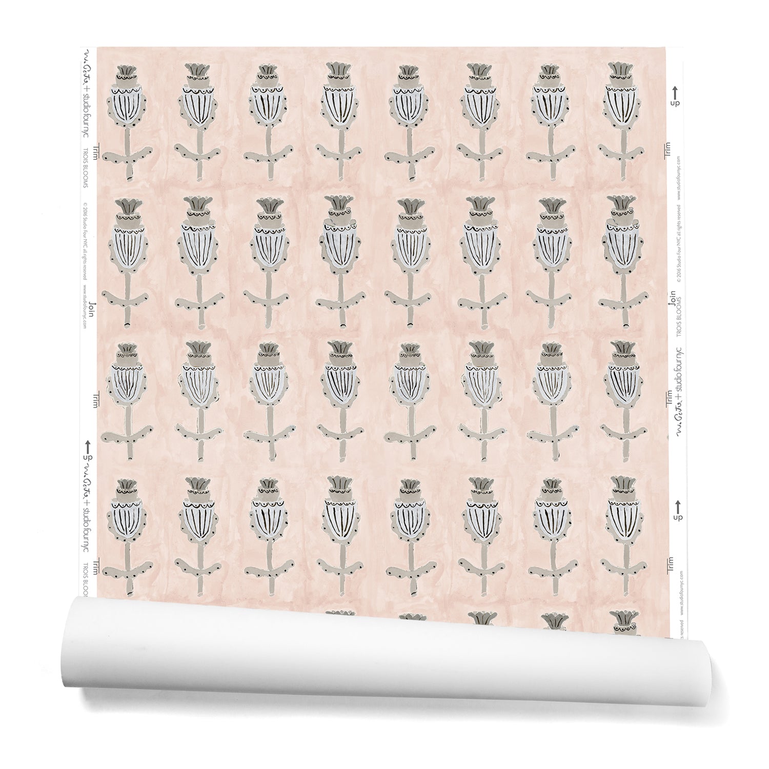 A hanging roll of wallpaper with repeating rows of a watercolor flowers in tan and gray on a light pink background.