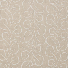 Woven fabric swatch with a large-scale repeating leaf print in white on a cream background.